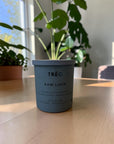 TRĒO Raw Linen candle on a wood table